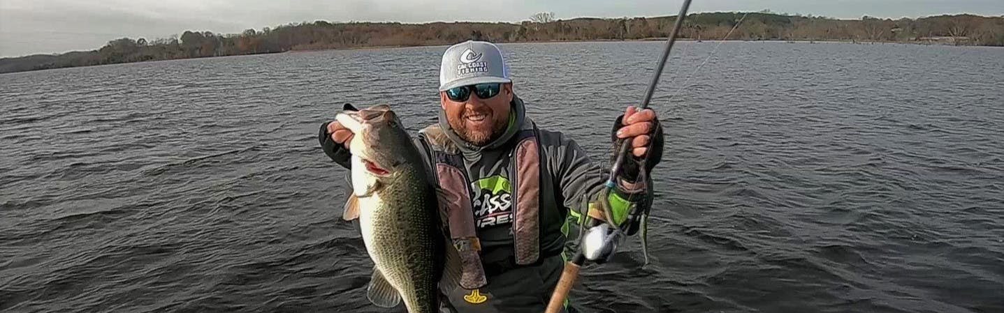 Jay Wallen using the Shimano Tranx 400 to haul in bass on the Alabama Rig.