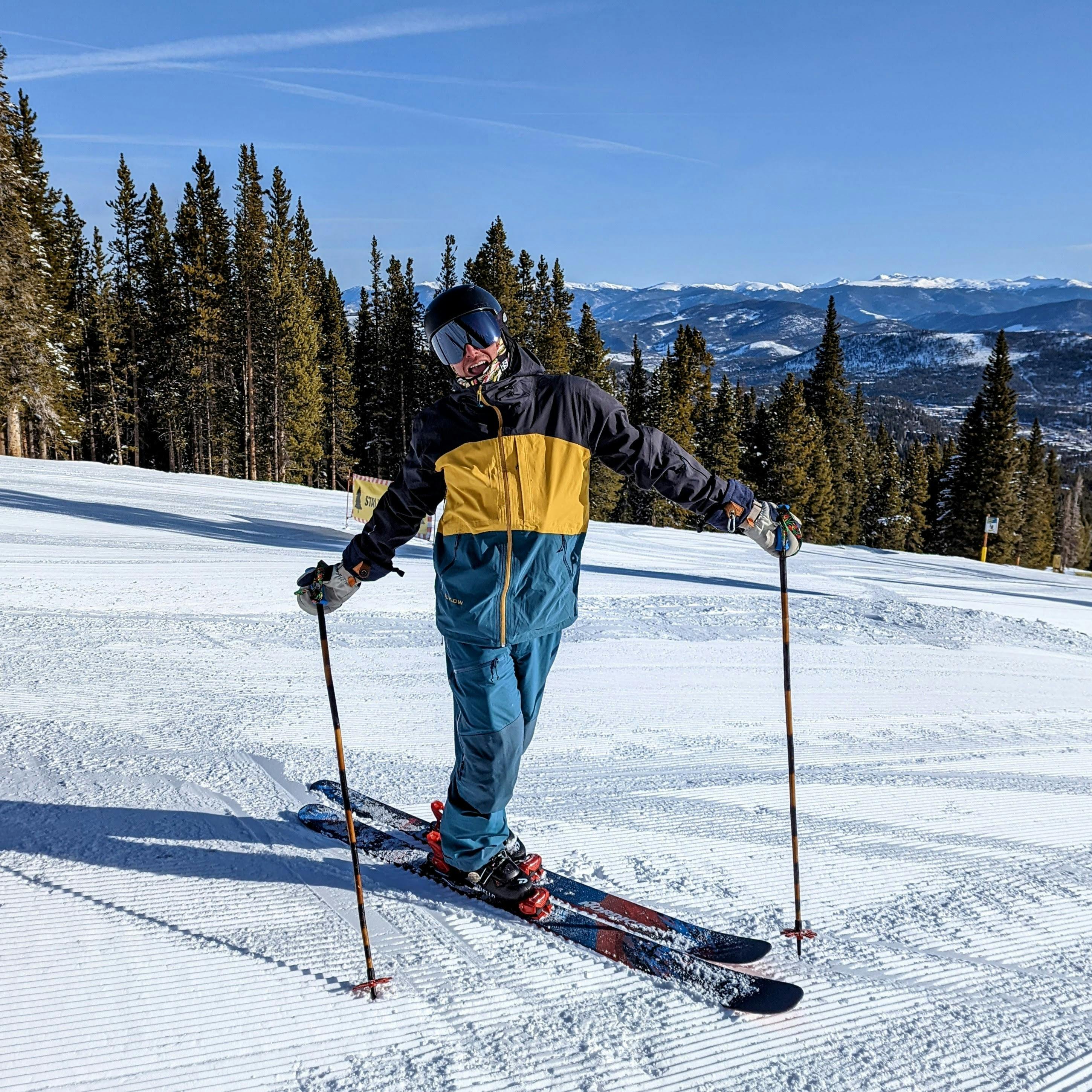 A skier standing on a ski run.