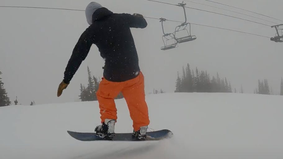 Curated Snowboard Expert Yuri Czmola jumping with the 2023 Never Summer Proto FR snowboard