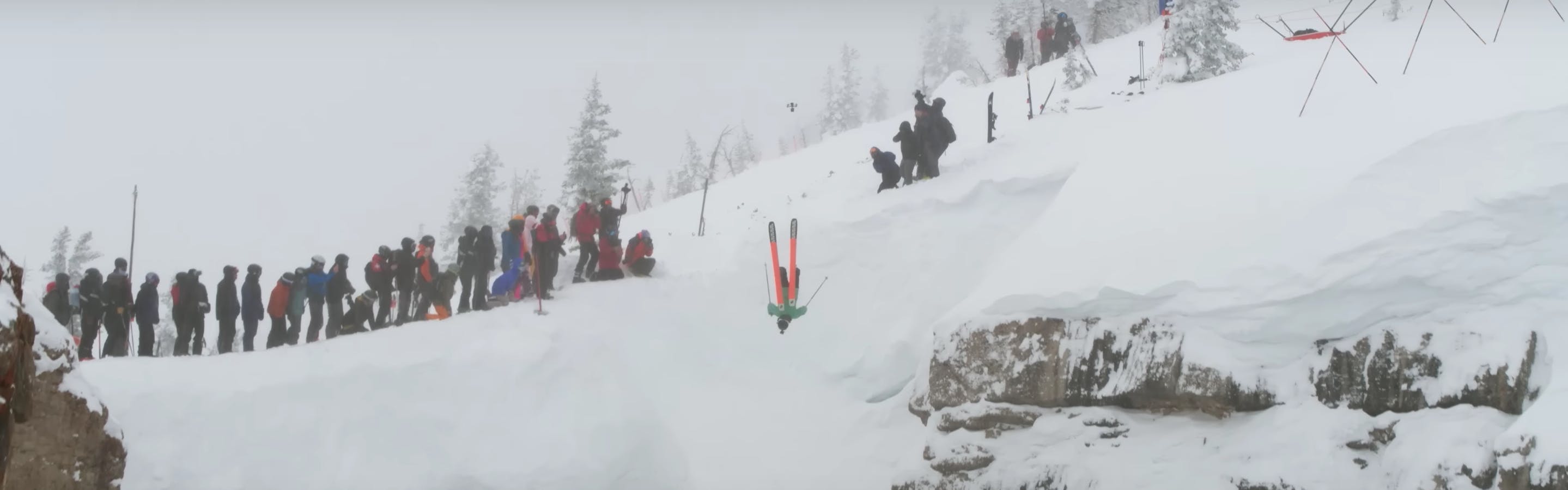 A skier drops into Corbet's coulier upside down for Kings and Queens of Corbet's. Photo comes from screenshot of Jackson Hole Mountain Resort's YouTube video "KINGS & QUEENS: MIND-BLOWING MOMENTS."