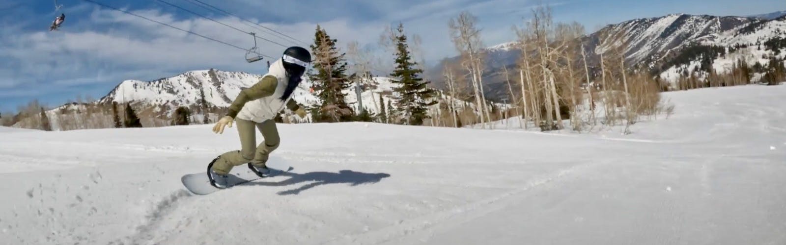 Snowboard Expert Sydney Johnson riding the Burton Family Tree 3D Daily Driver snowboard on a groomer run