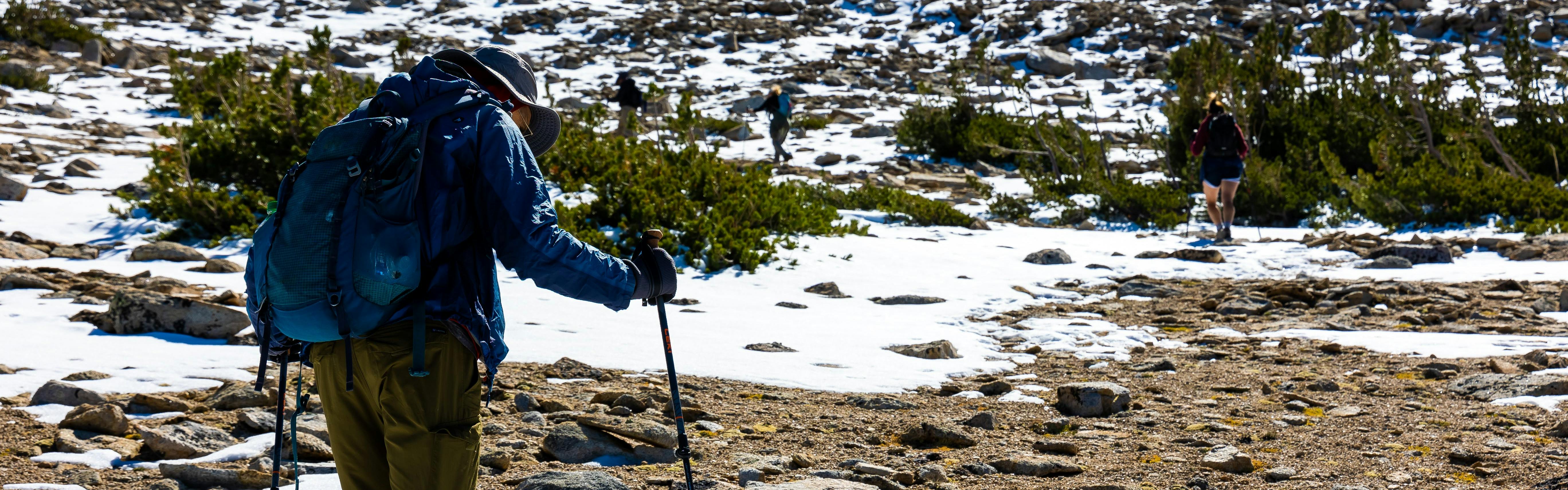A hiker hiking with the Leki Legacy Lite Trekking Poles.