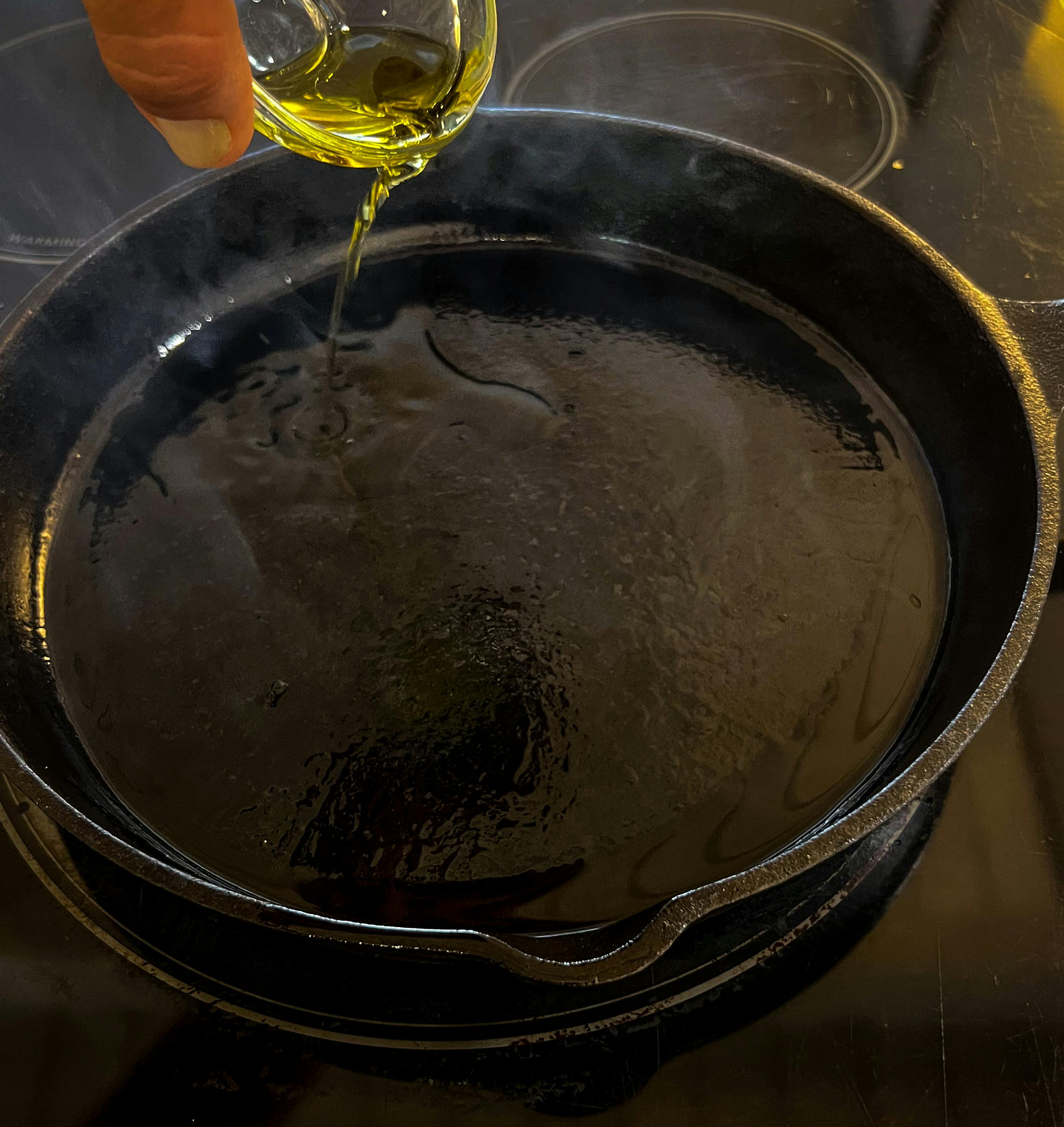 Pouring oil onto the pan
