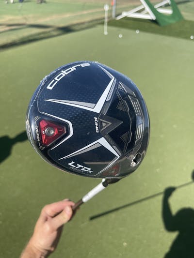 Close up of the Cobra LTDx MAX Driver on a golf course.