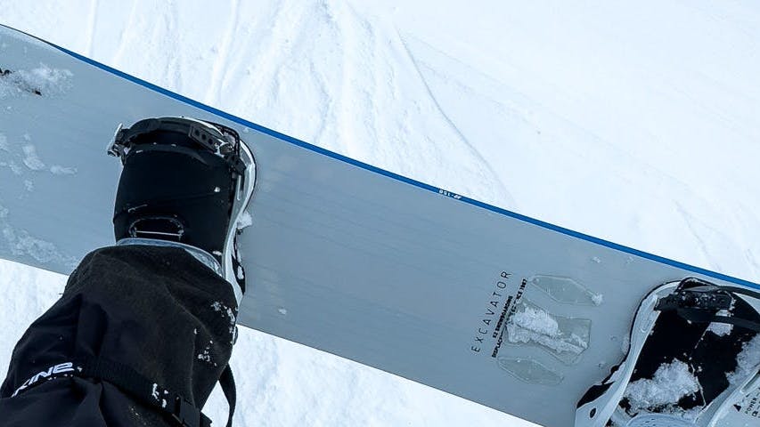 Top down view of the K2 Excavator Snowboard · 2022 from a chairlift. 