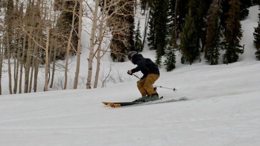 A man skiing down a run. 