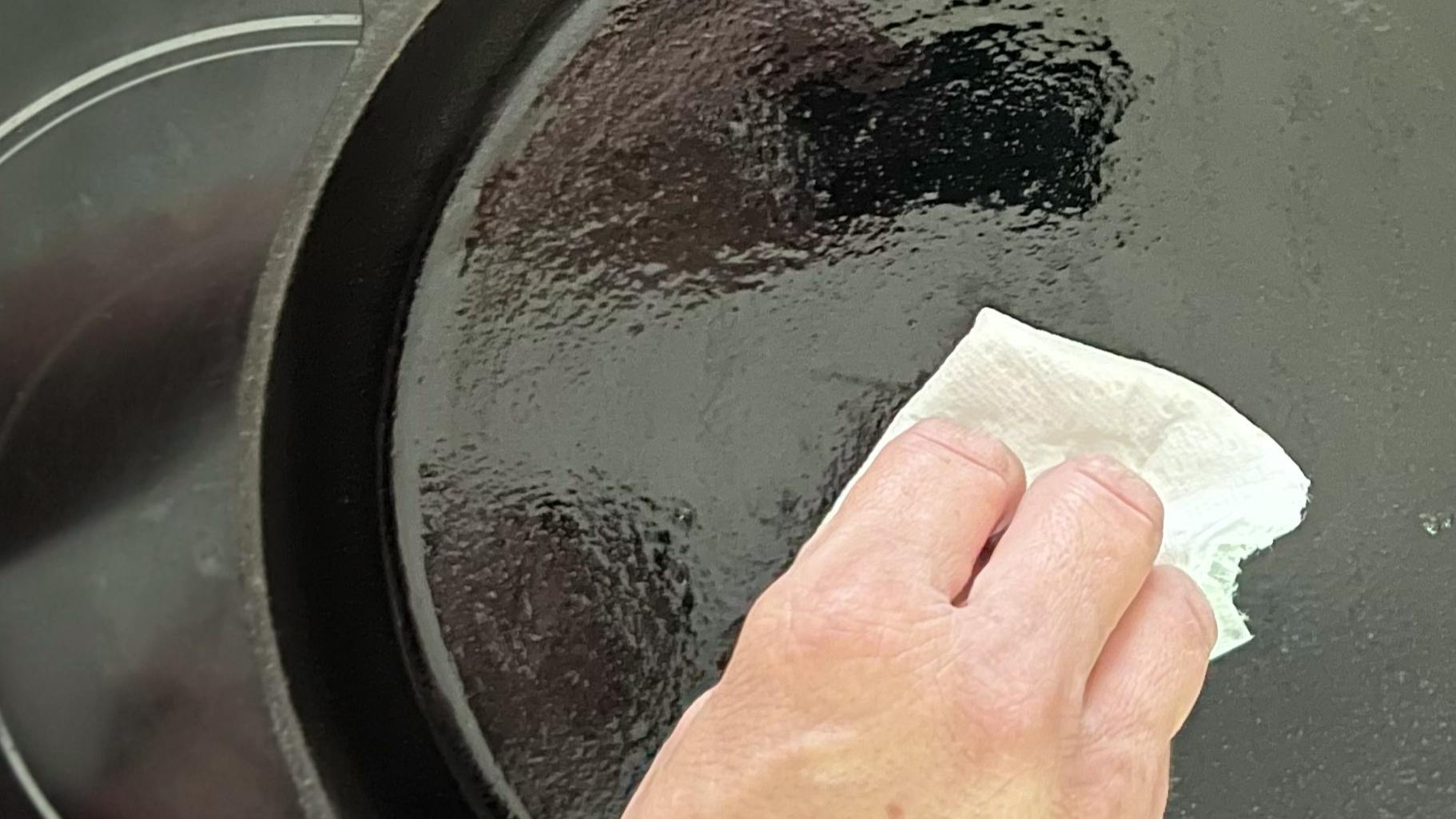 Wiping down a cast iron pan