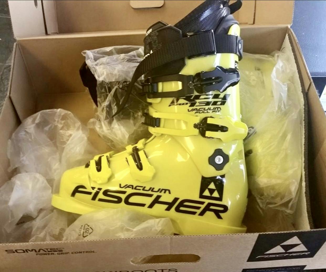 The  Fischer RC4 Podium 130 Ski Boots · 2020 in their box.