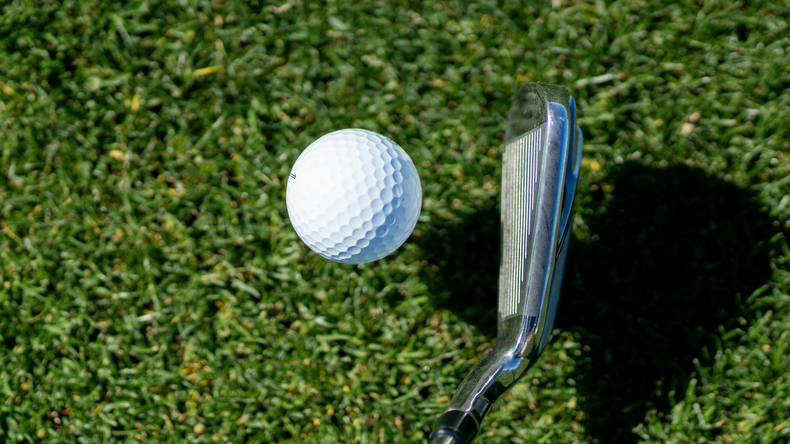 Golf ball teed up for tee shot with iron