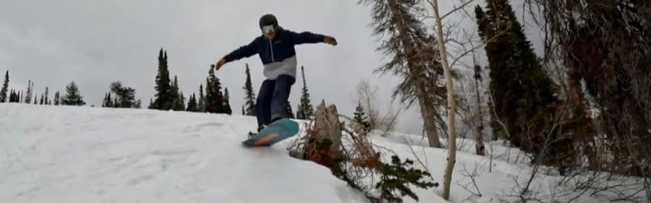 Snowboard Expert Matthew Kaminski jumping off a side hit with the 2023 K2 Party Platter snowboard