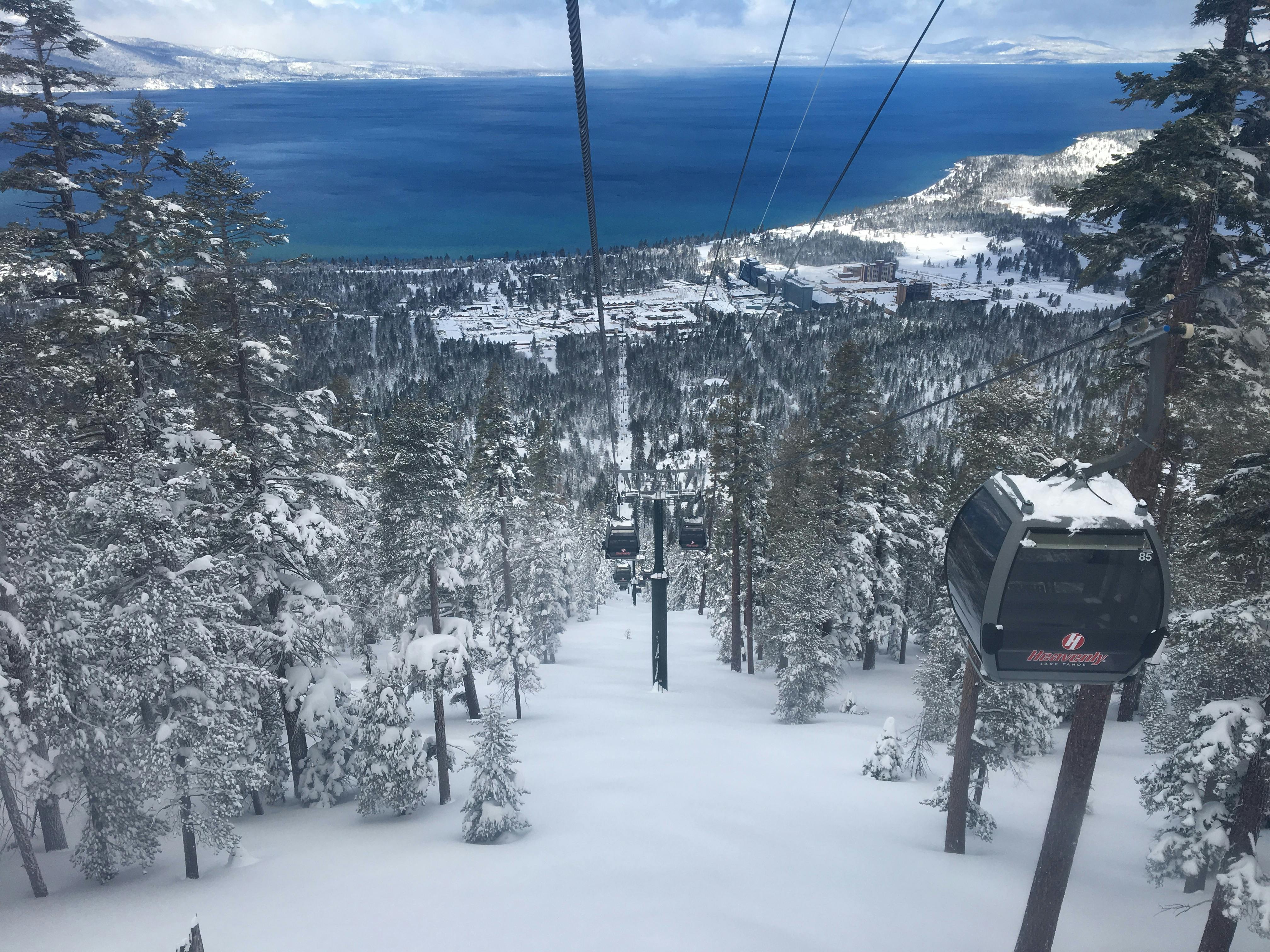 Top down view of a ski gondola with Lake Tahoe in the background. 