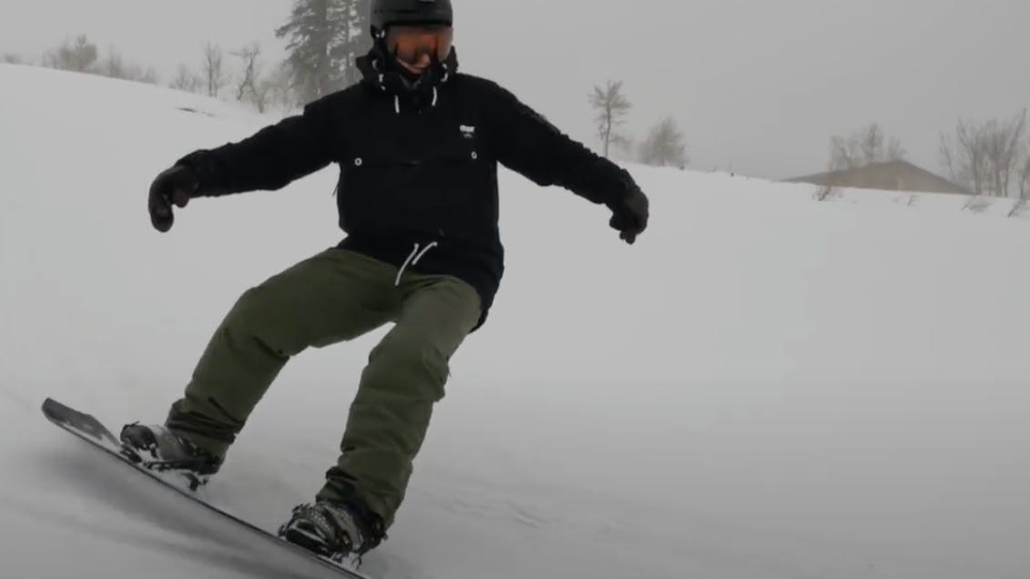 Snowboard Expert Everett Pelkey riding the 2023 Lib Tech Orca snowboard in foggy conditions