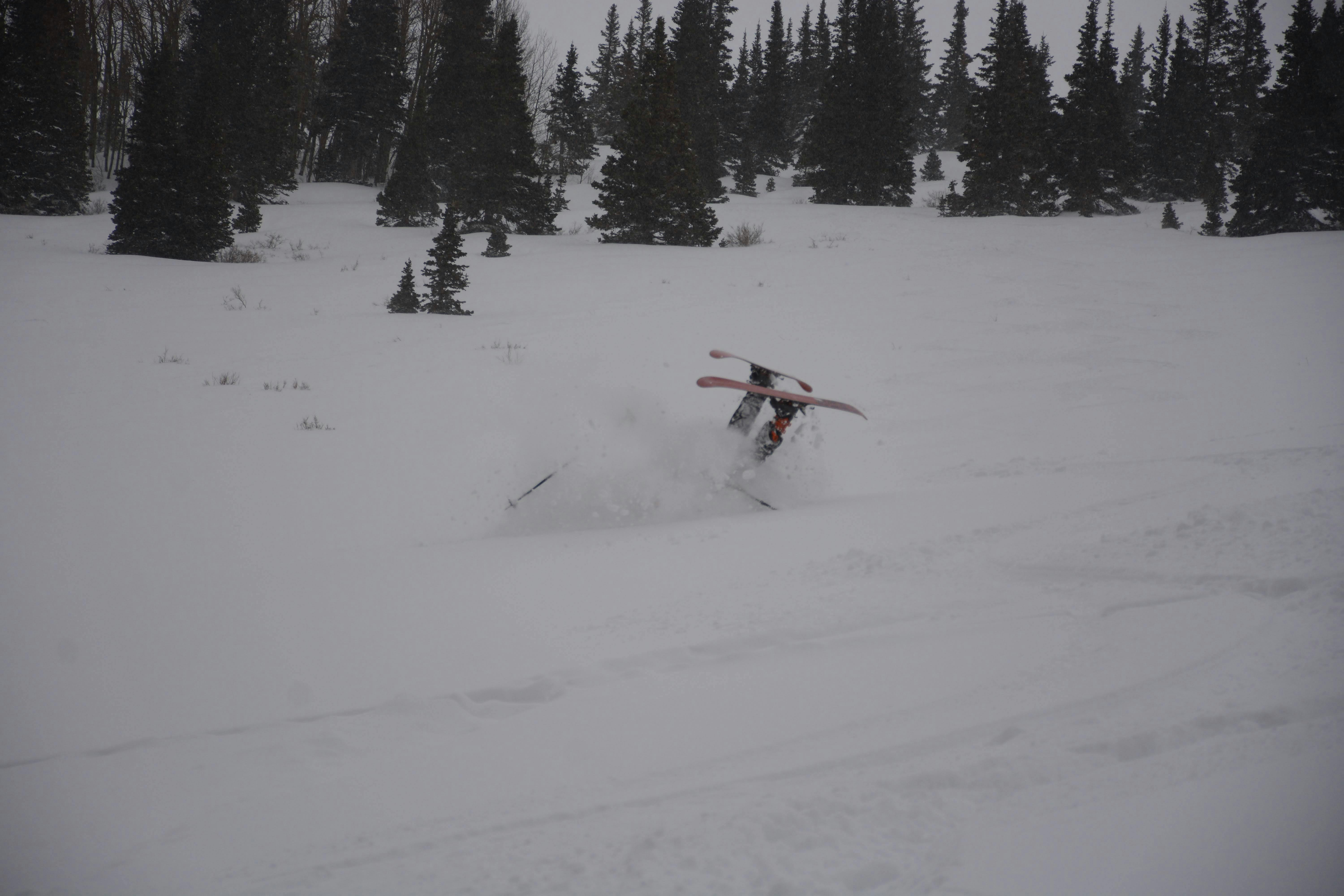 A skier turning down a snowy run.
