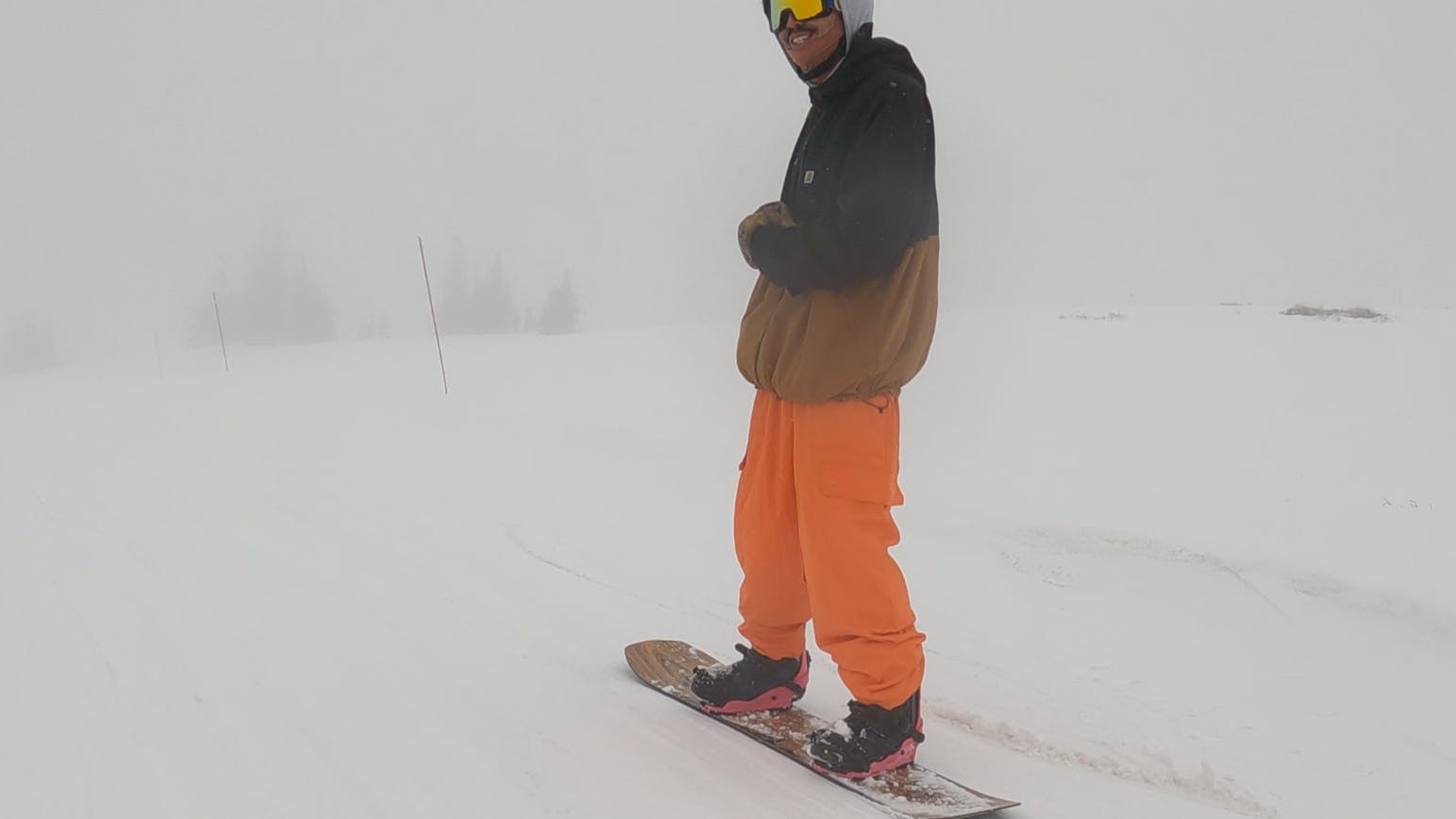 A snowboarder riding the 2023 Jones Flagship Snowboard.
