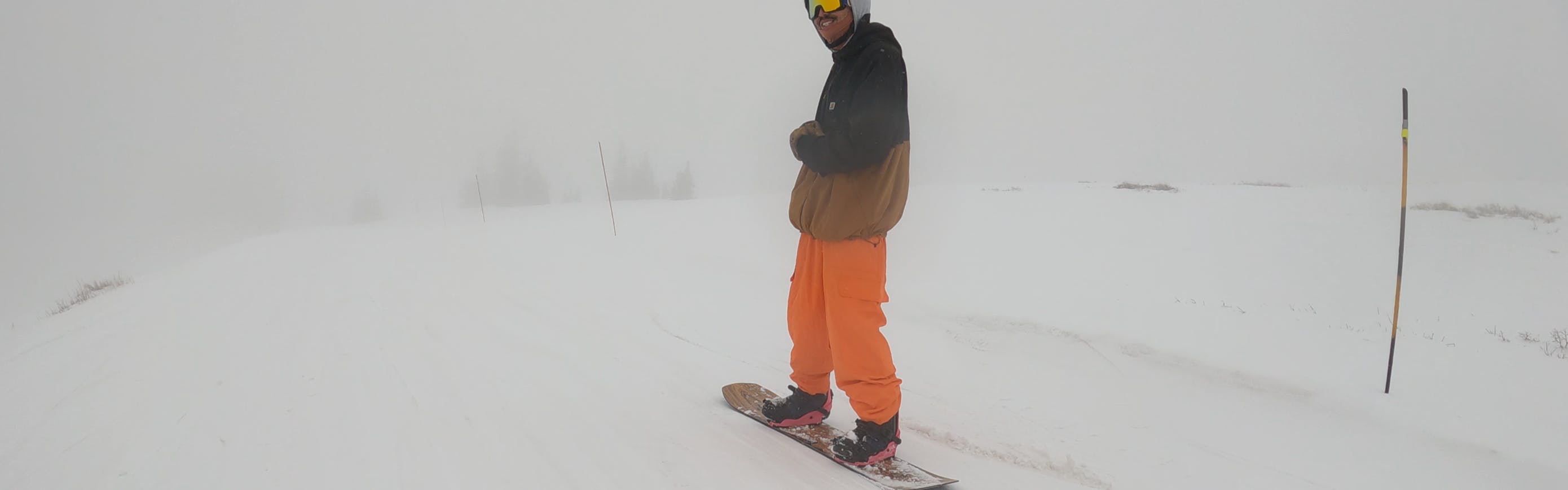 A snowboarder riding the 2023 Jones Flagship Snowboard.