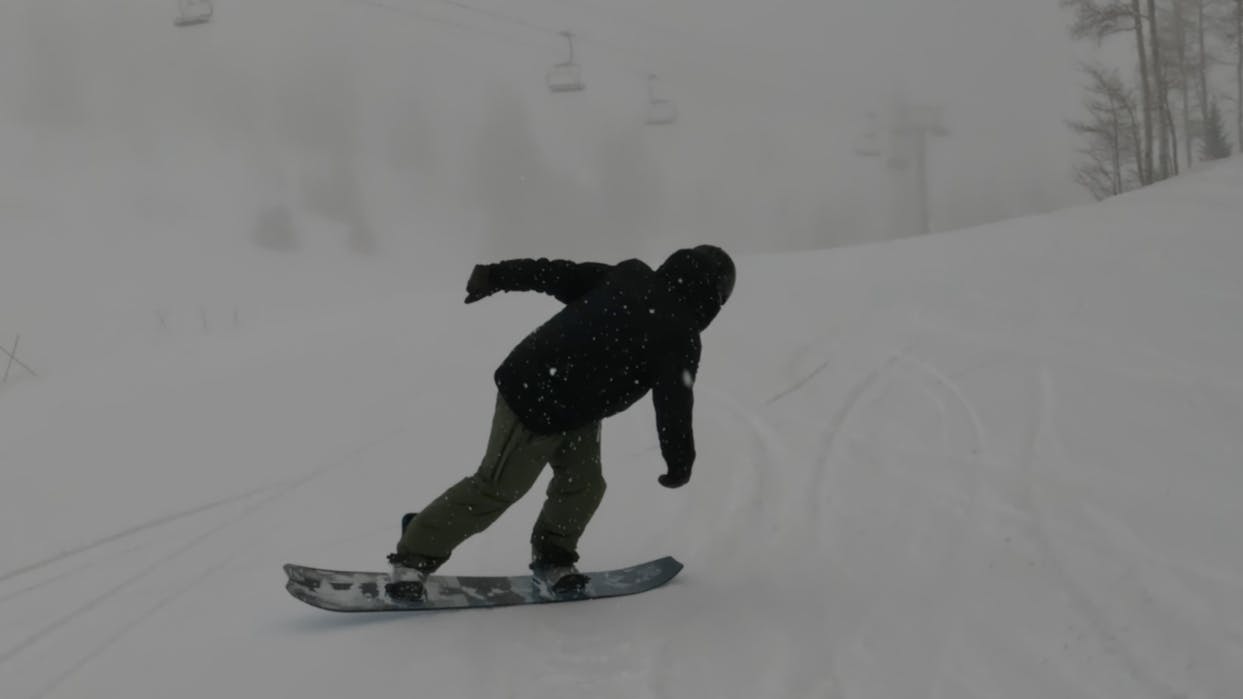 A snowboarder on the Yes. Warca Snowboard. 