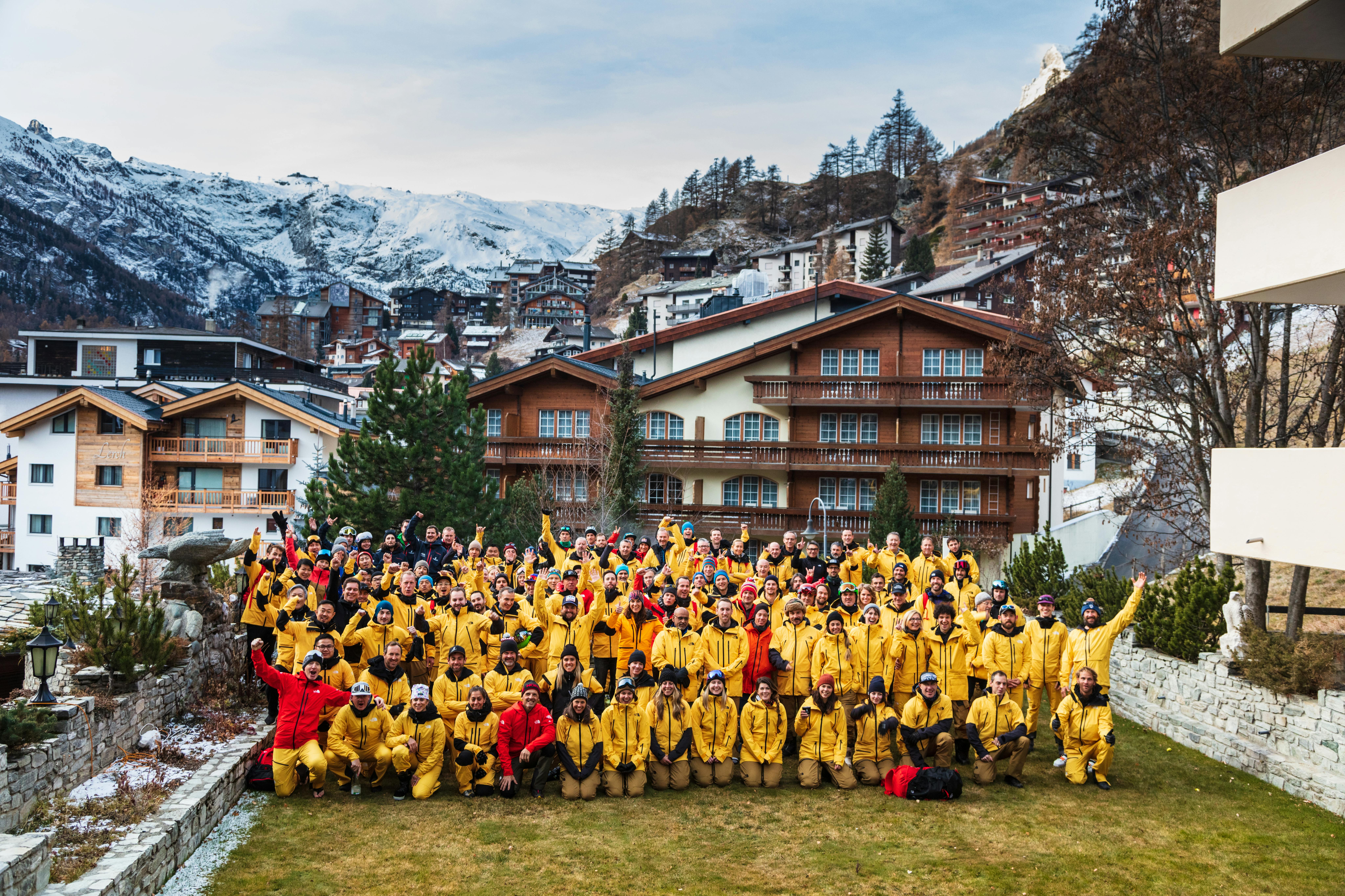 The North Face staff in a group photo in a mountain town before the pandemic.