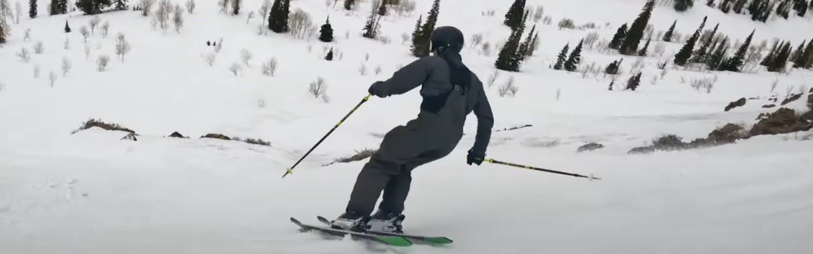 A skier skiing down a snowy hill with the Dalbello Moro II Ski boots. 