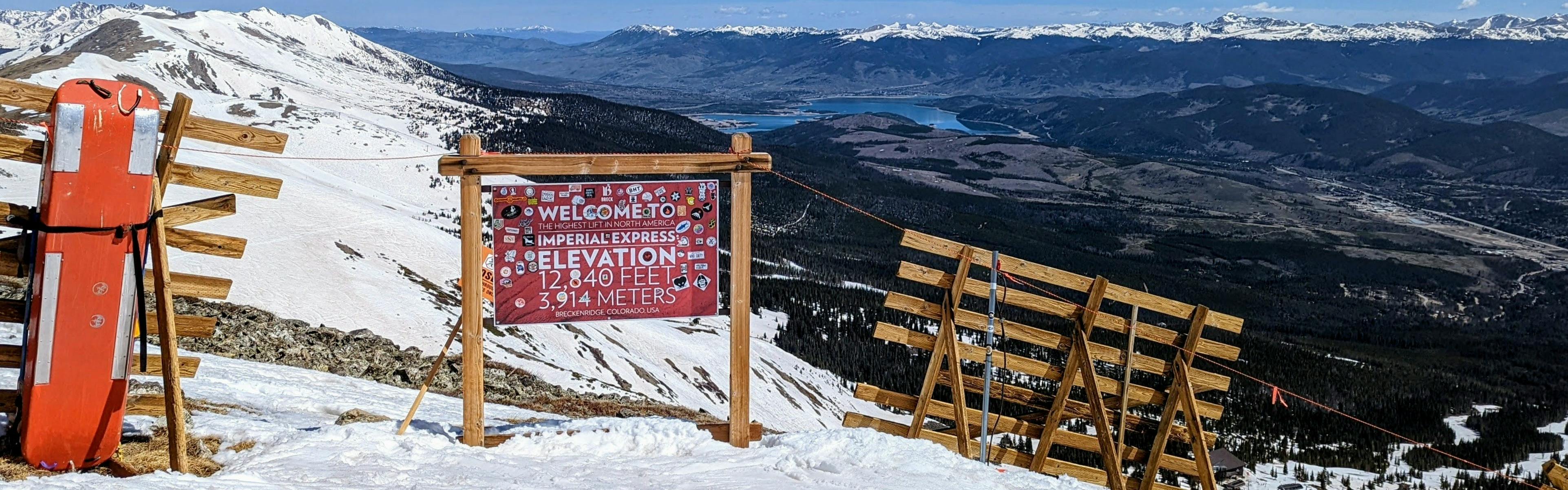 A trail sign covered in stickers in Breckenridge, Colorado. 