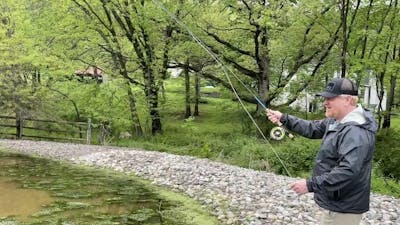 Man using the Orvis Mirage USA Fly Reel.