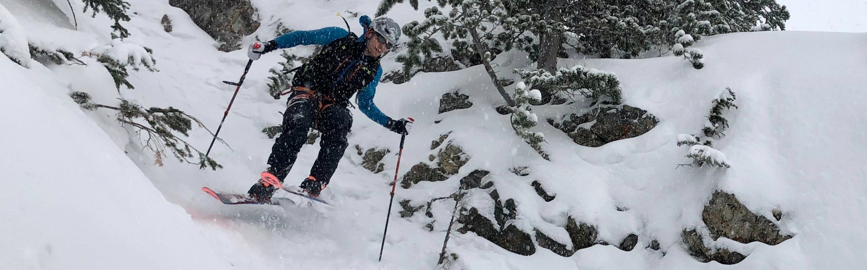 Will Shaw going through steep trees in his Blizzard Zero G 105s
