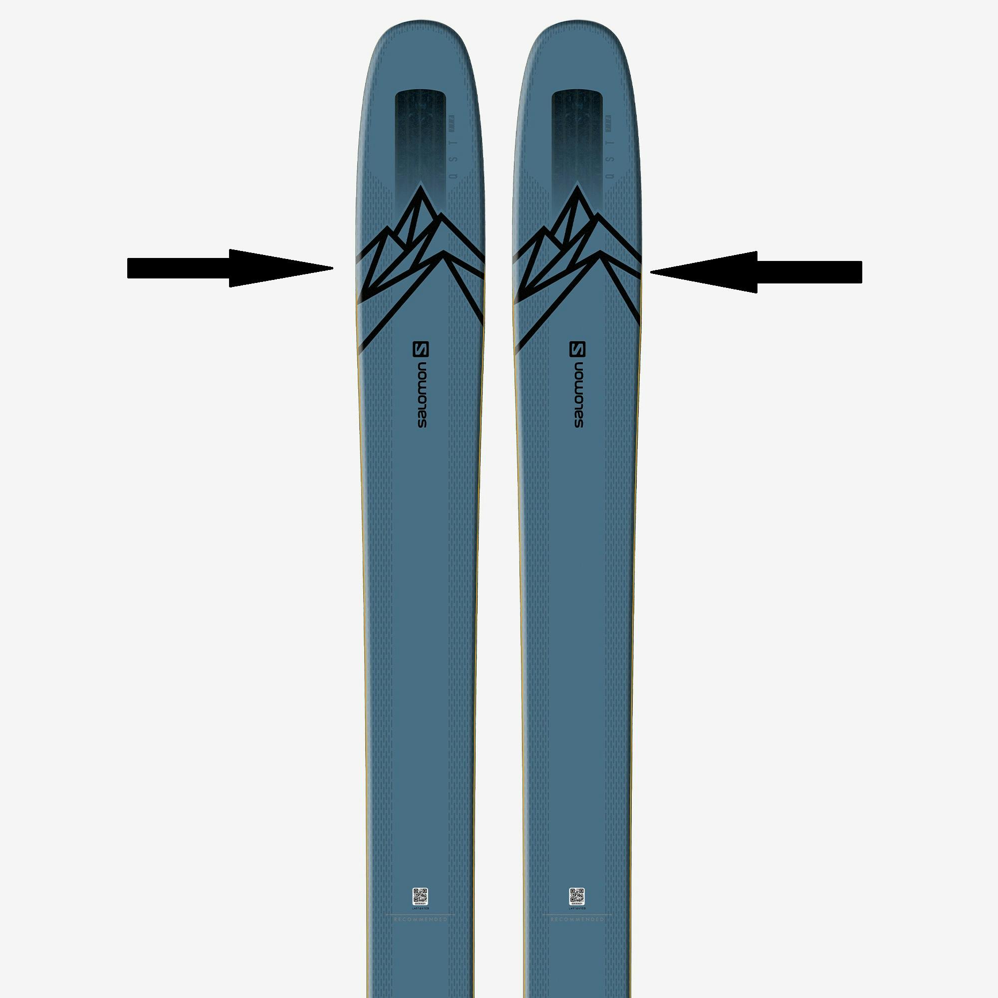 Arrows pointing out tip taper, the widest point of the ski, on a pair of skis