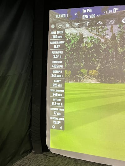 Screen showing golf stats at a golf simulator. 