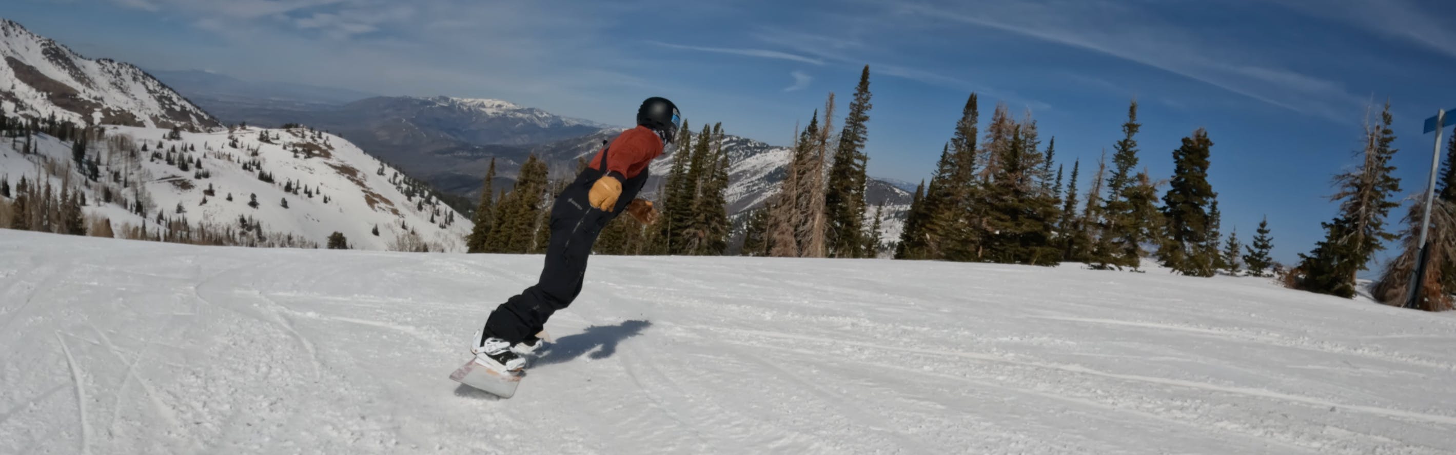 A snowboarder riding the Roxy Breeze Snowboard.
