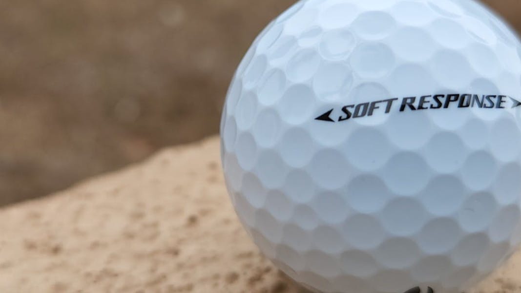 A TaylorMade Soft Response Golf Ball.