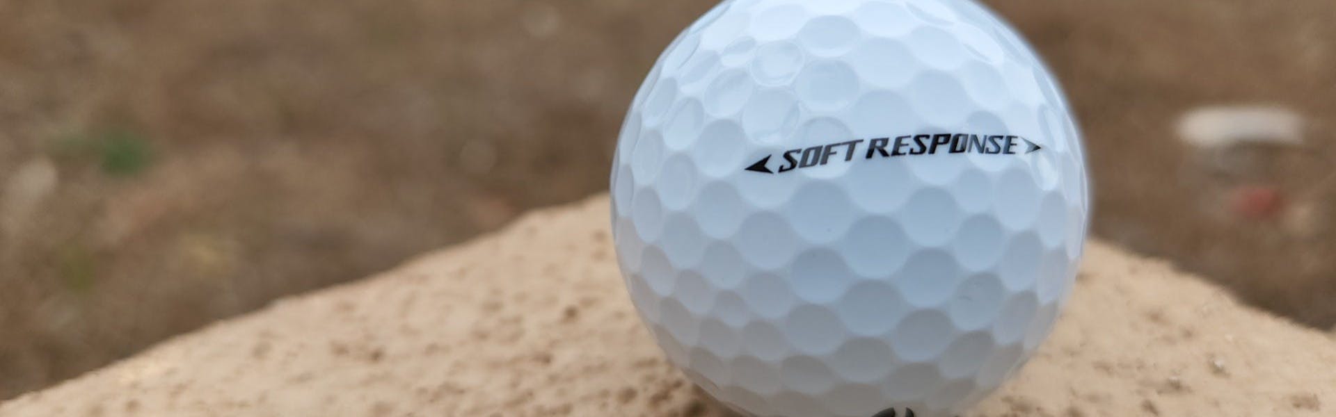 A TaylorMade Soft Response Golf Ball.