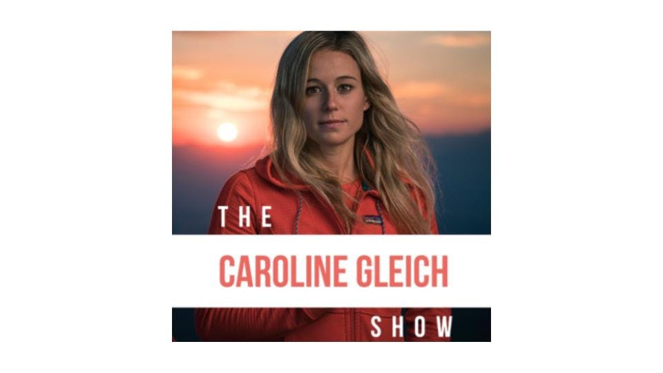 Podcast cover of "The Caroline Gleich Show". Features Caroline Gleich standing in front of a sunset. 
