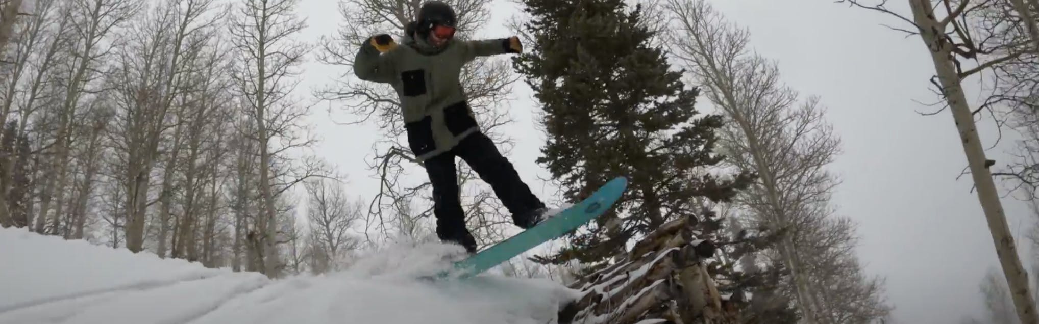 Curated Snowboard Expert Spencer Storck jumping with the 2023 Burton Daily Driver snowboard