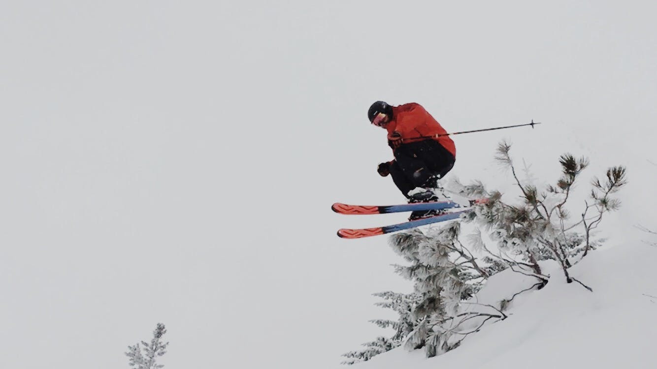 A skier going off a jump. 
