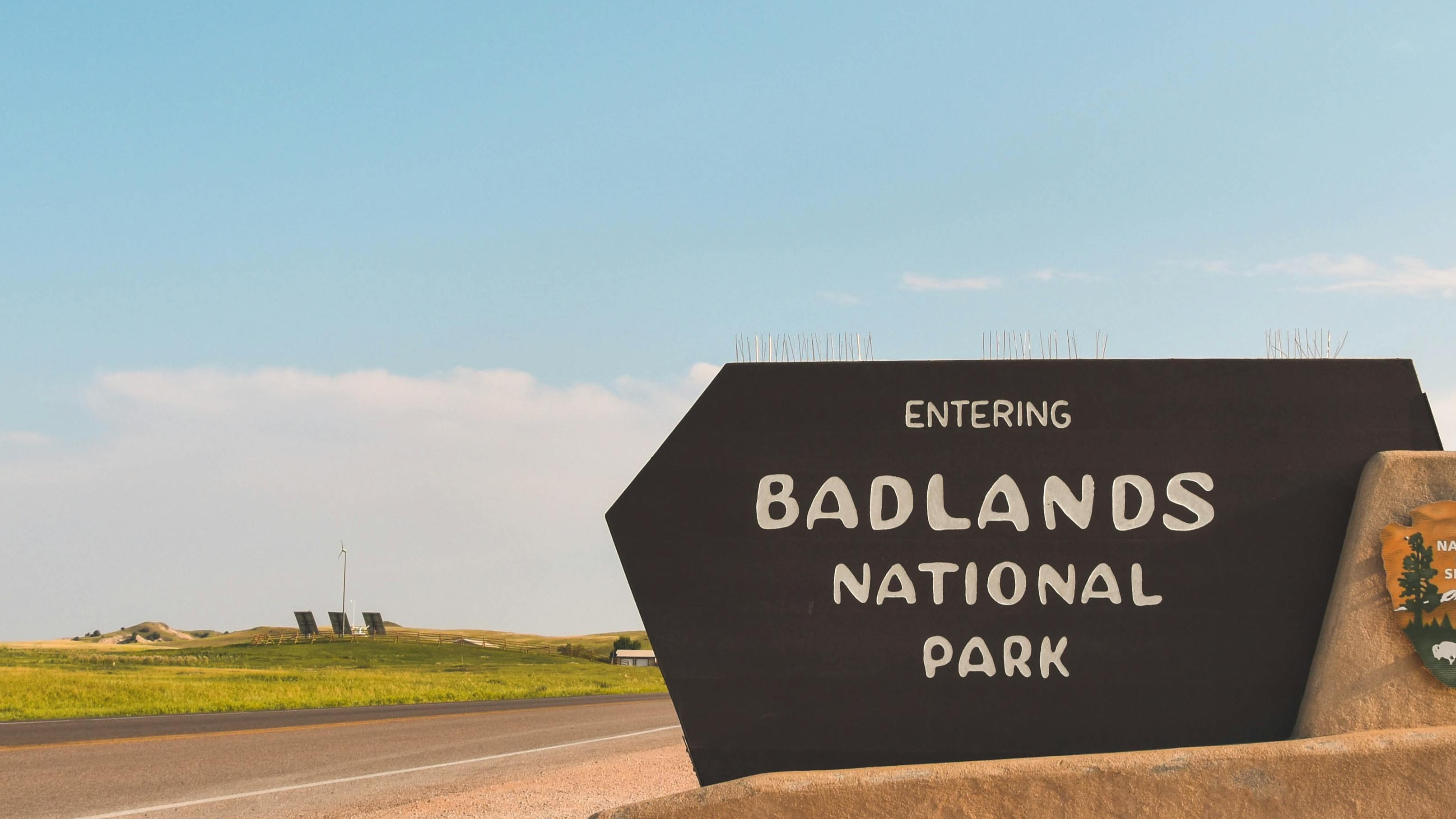 Sign that reads "Badlands National Park".