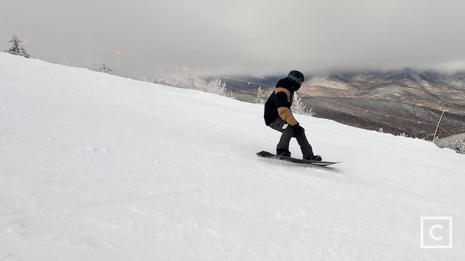 Curated expert Colby Henderson carving on the Lib Tech Orca snowboard