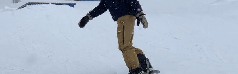 A snowboarder while wearing the Burton Men's Profile Mittens.