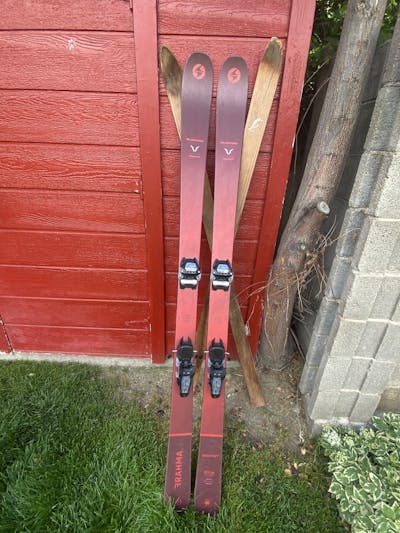 The Blizzard Brahma 88 skis resting against a shed.