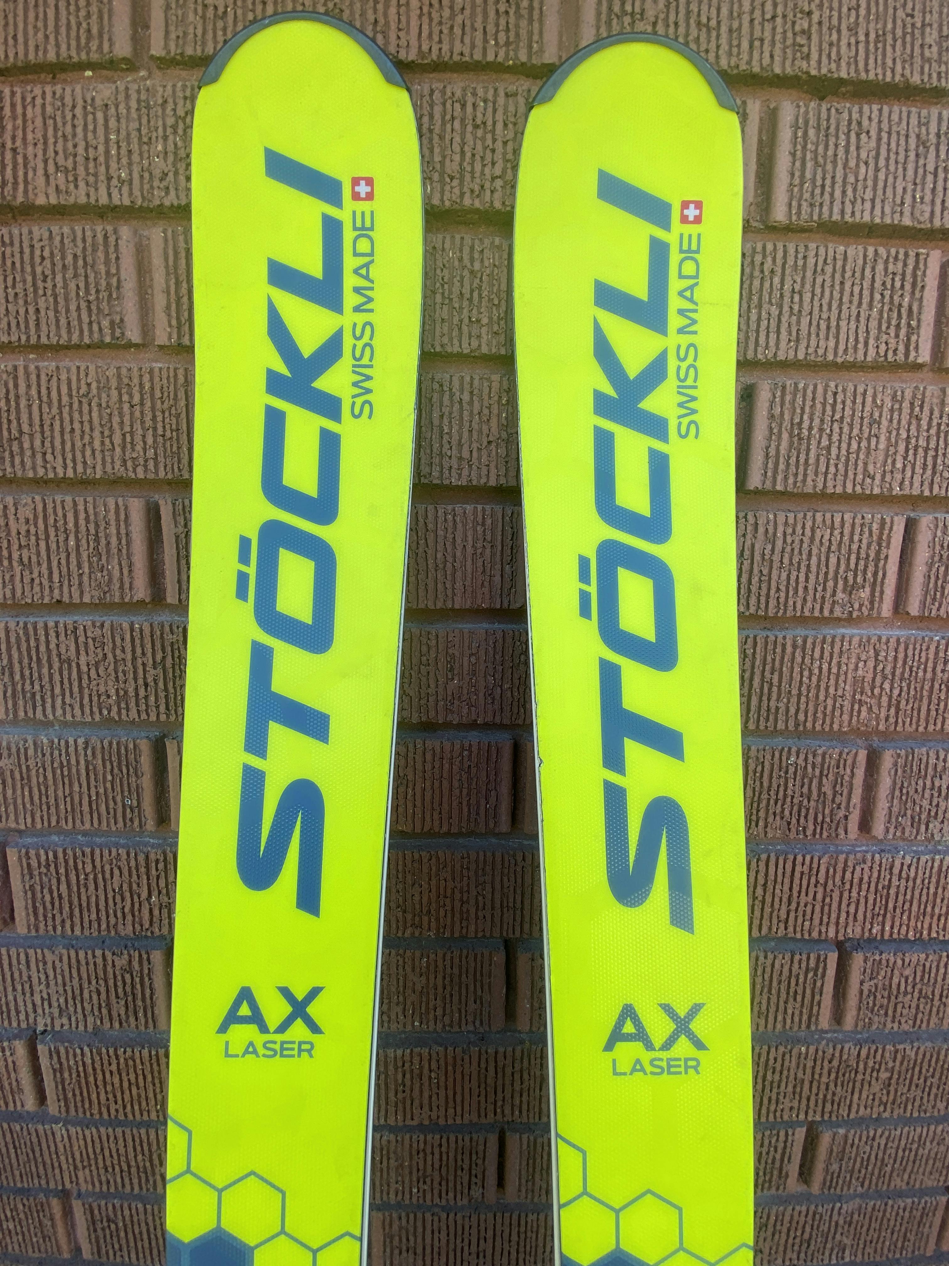 Tips of the Stockli Stockli Laser AX Skis W Dxm 13 Bindings.