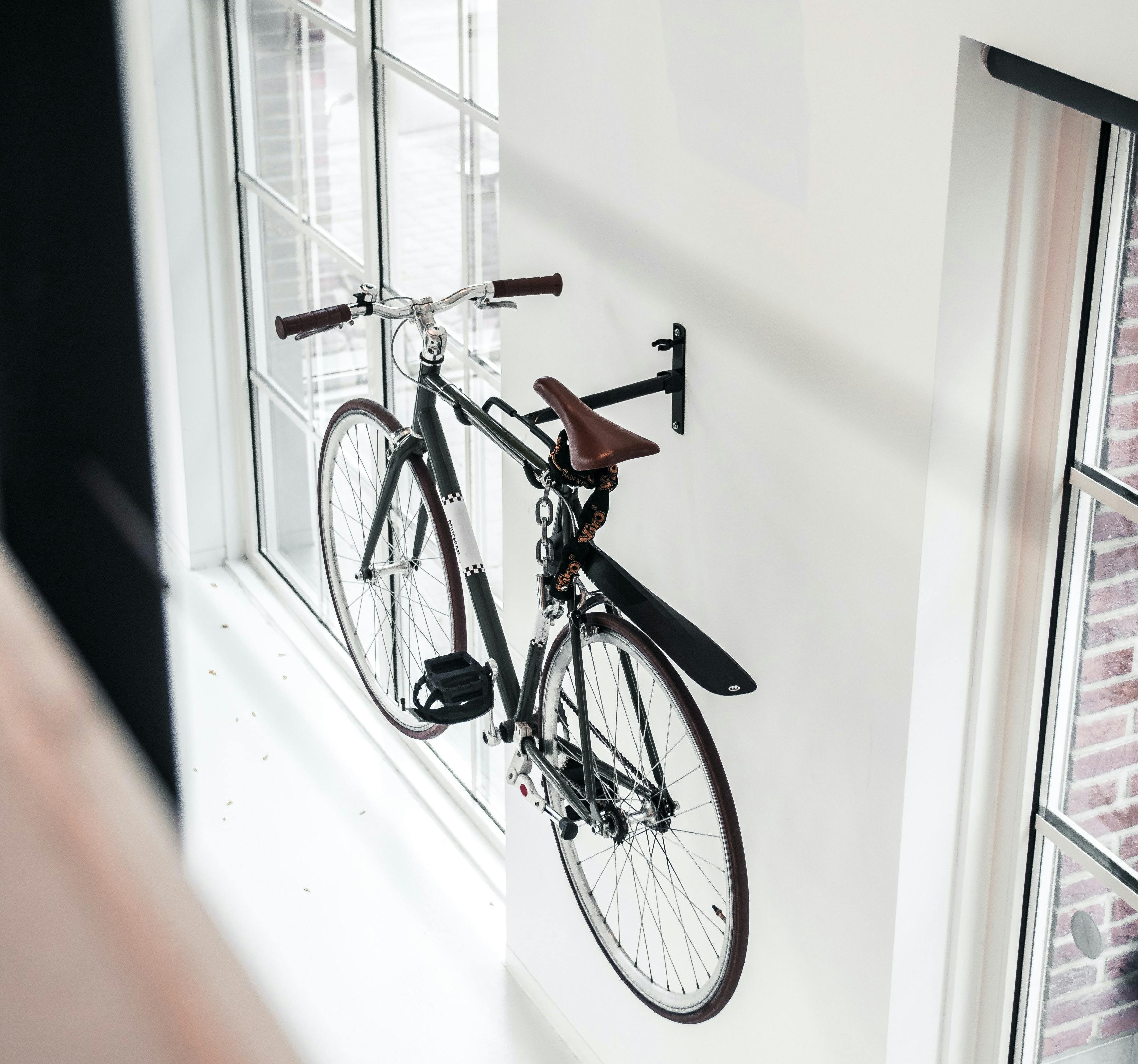 A bike mounted to a wall.