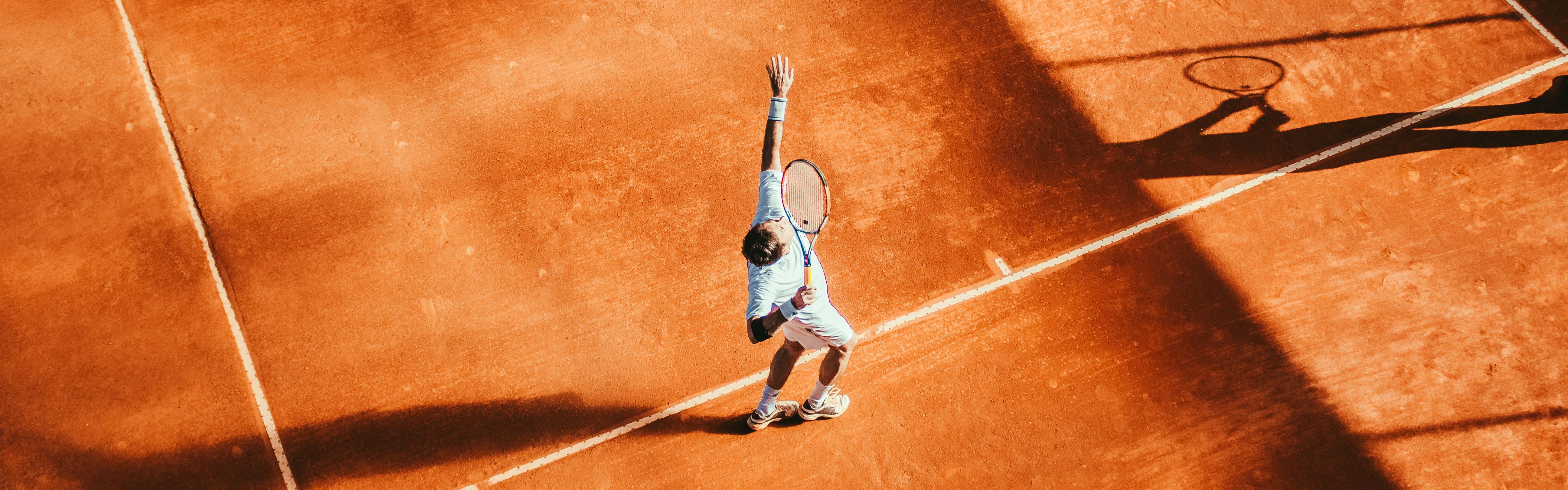 A tennis player hitting a tennis ball. 