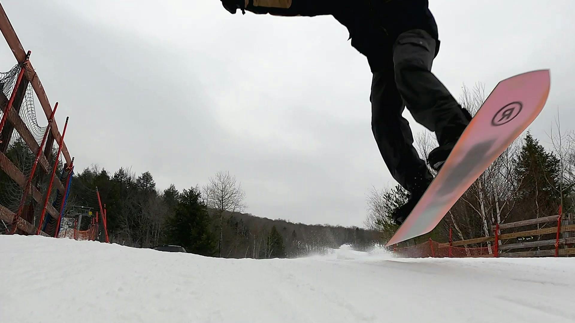 Curated Colby Henderson continuing a jump with his snowboard