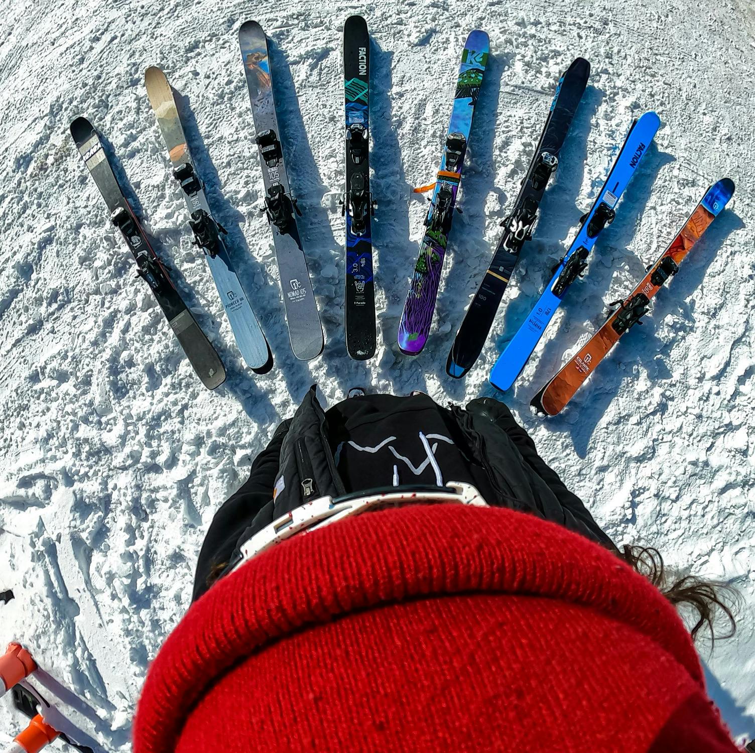 Top down view of several pairs of skis. 