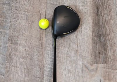 The Cobra LTDx LS Driver in front of a golf ball.