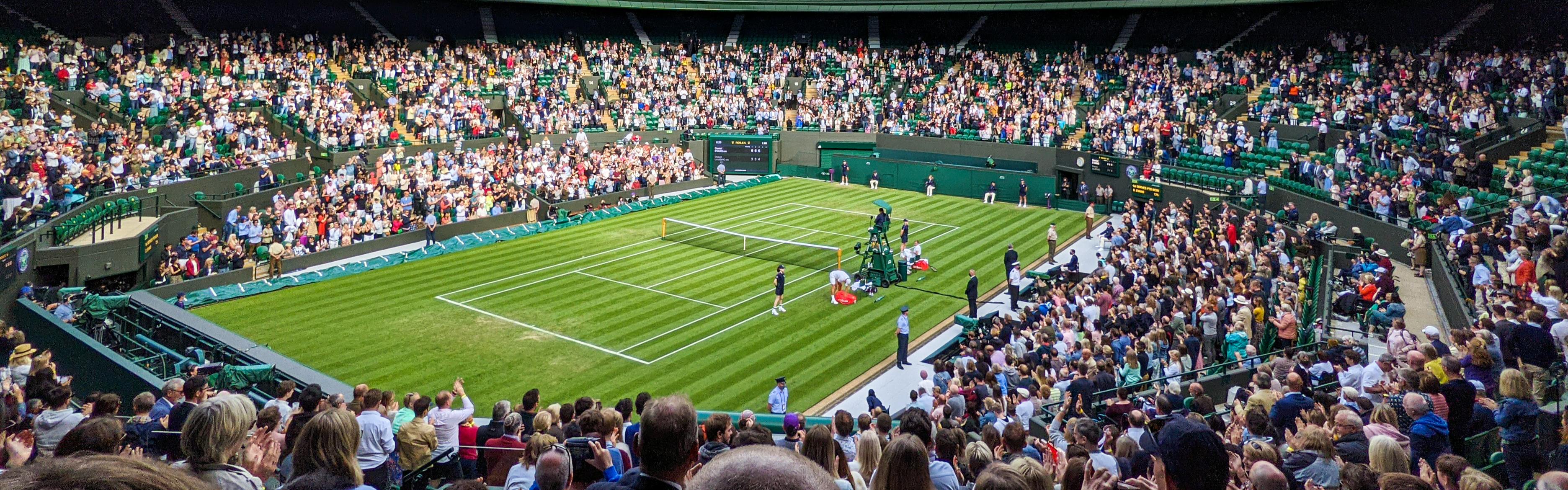 An image of the court and its surrounding crowds at Wimbledon.