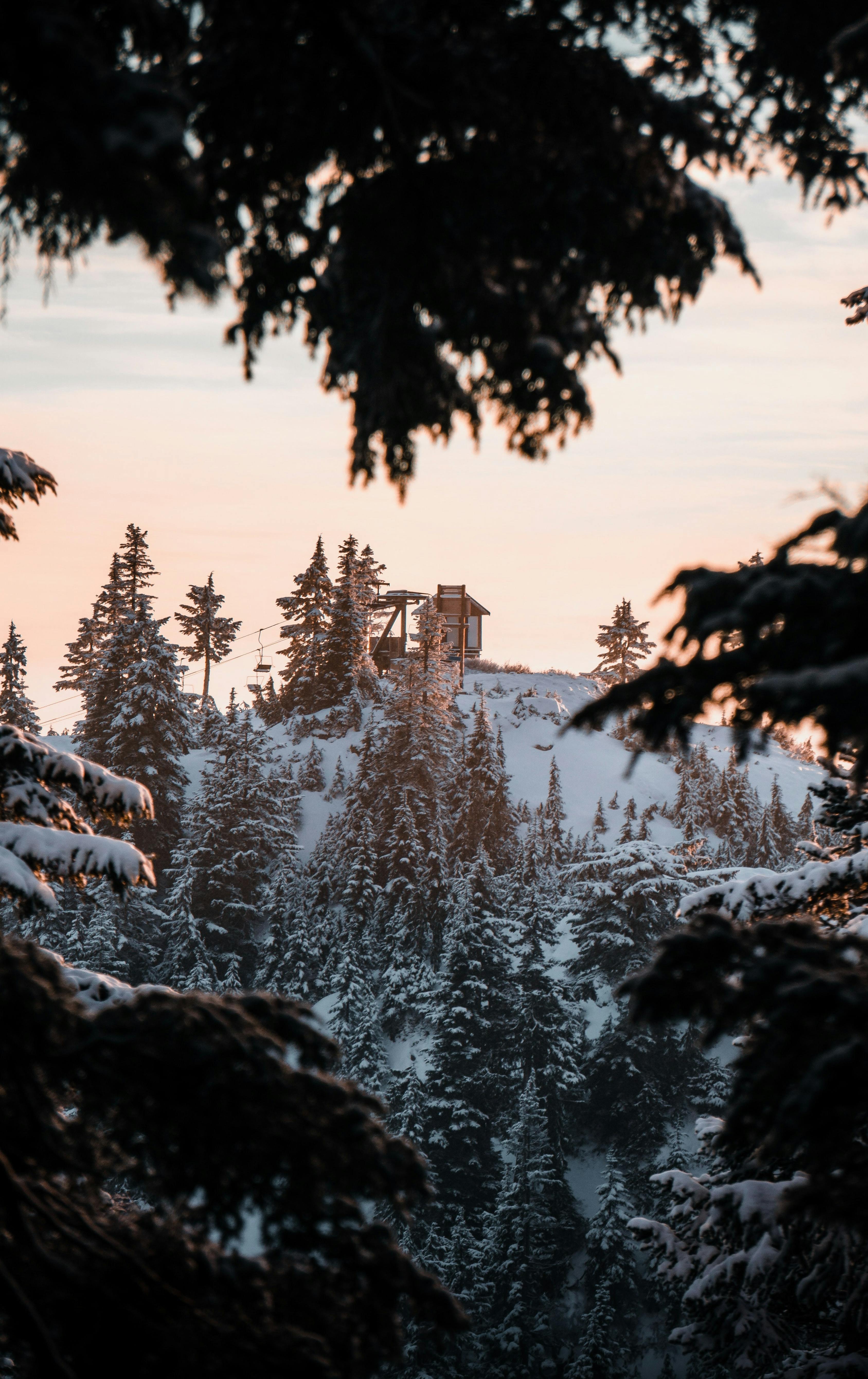 The top of the chairlift peaks out at Mount Seymour at dusk.
