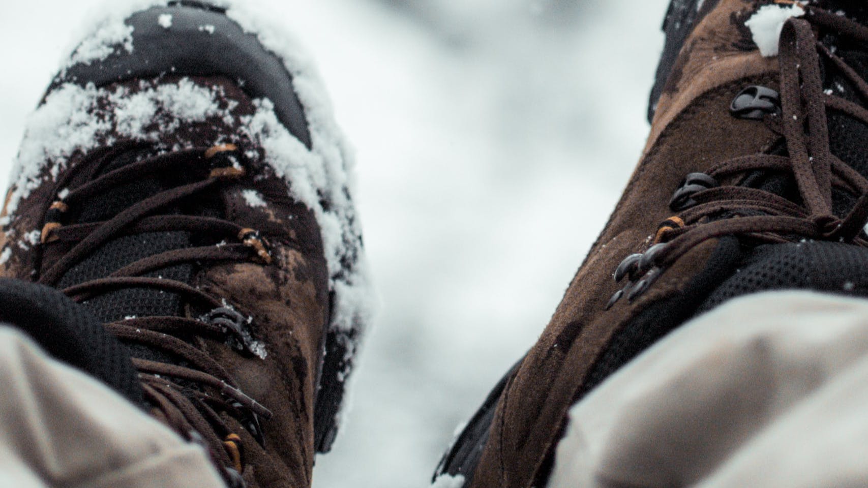 Closeup on winter boots dusted with snow