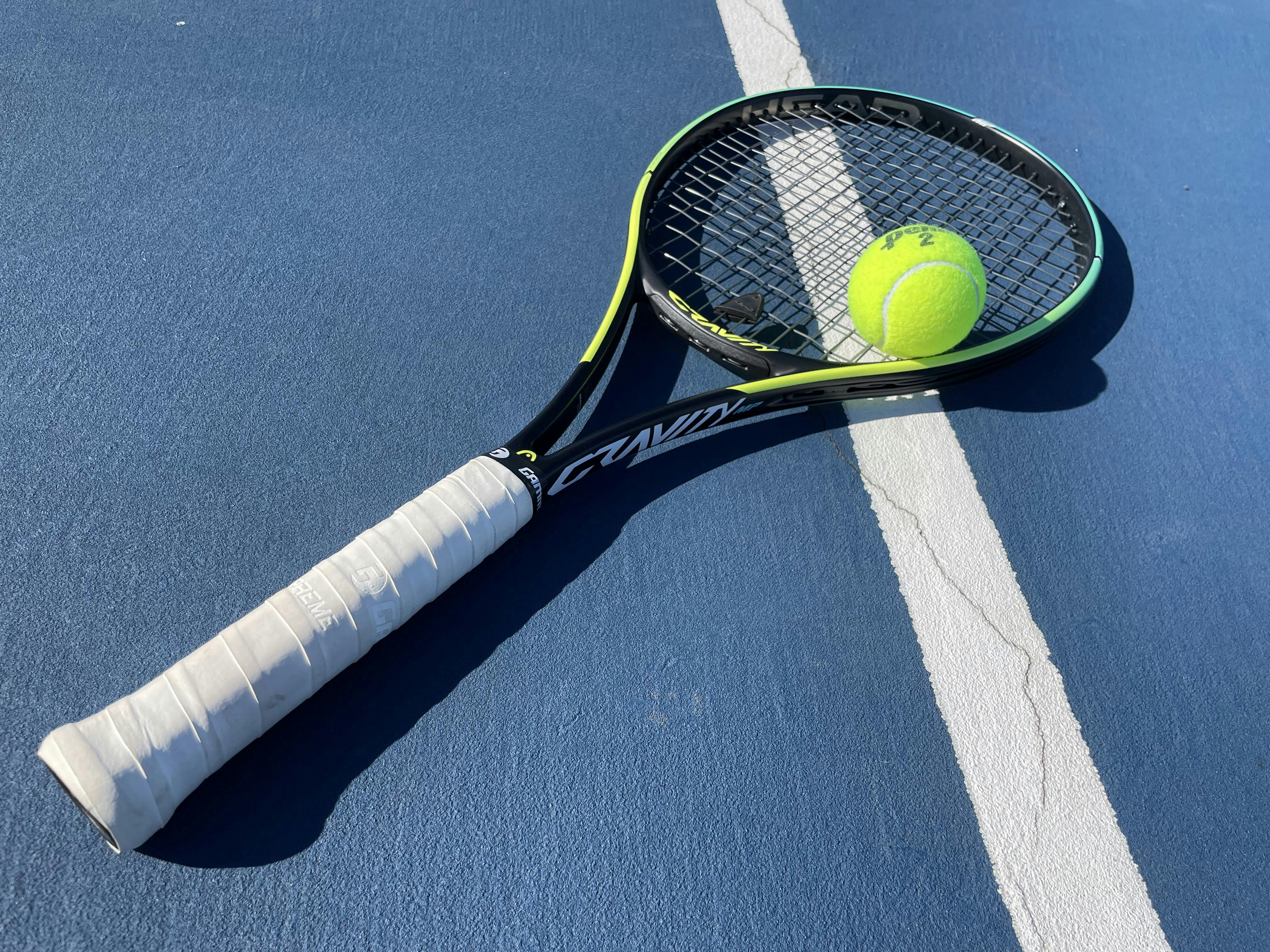 The Head Gravity MP Racquet in the color yellow.