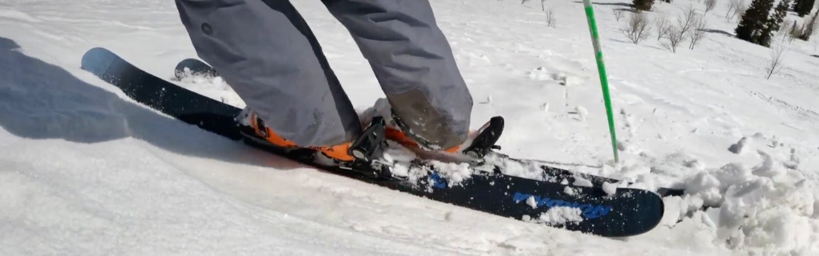 Closeup on the 2023 ​​Nordica Unleashed 98 skis in the snow