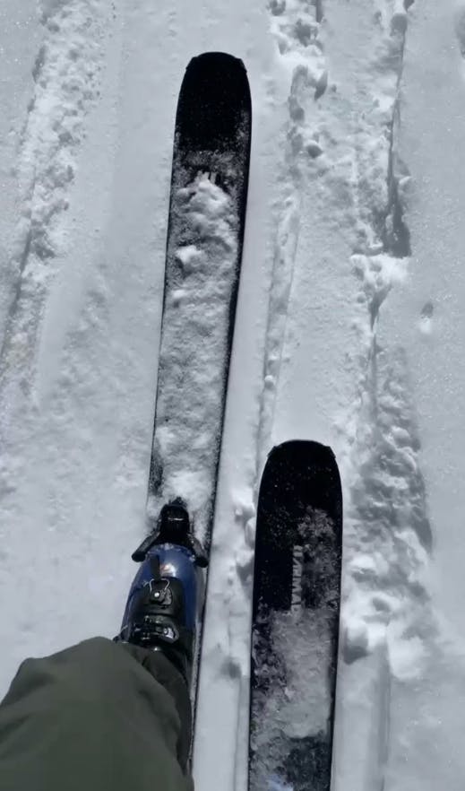 Top down view of some skis walking up a mountain. 