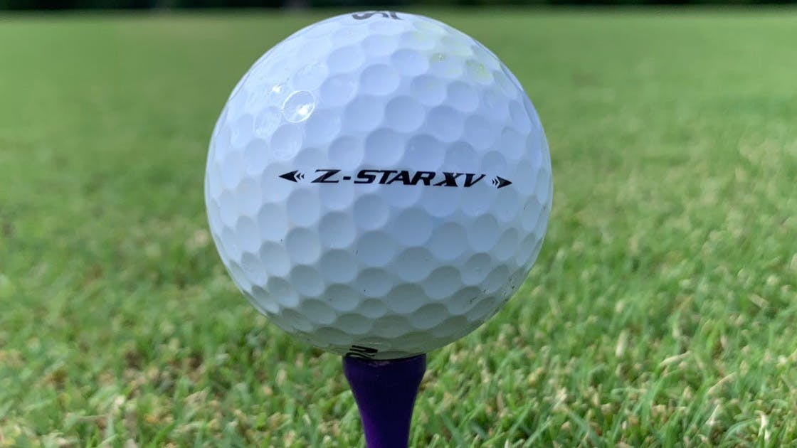 A Srixon Z XV Star 7 Pure White Golf Ball on a tee. 